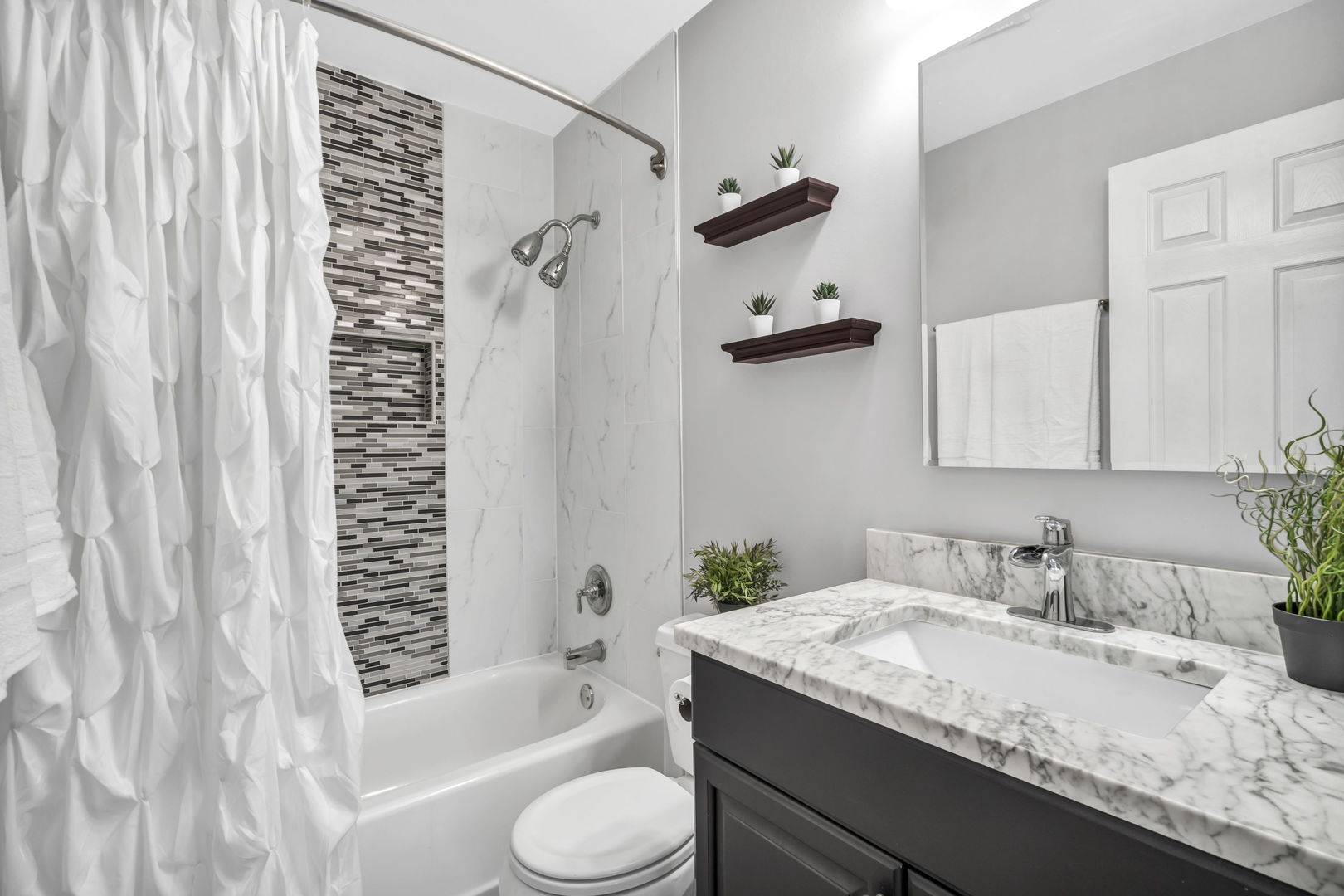 4721 St Joseph Creek Road, Unit 3H Lisle, IL 60532 - Photo 14 of 17 a bathroom with a granite countertop sink toilet and shower