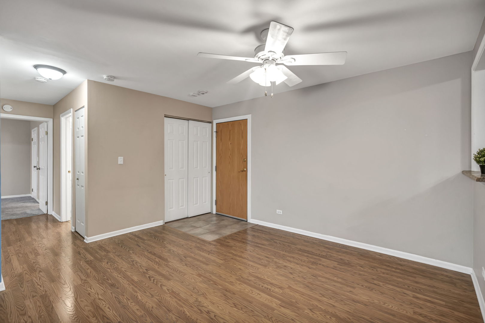 4721 St Joseph Creek Road, Unit 3H Lisle, IL 60532 - Photo 4 of 17 a view of an empty room with wooden floor