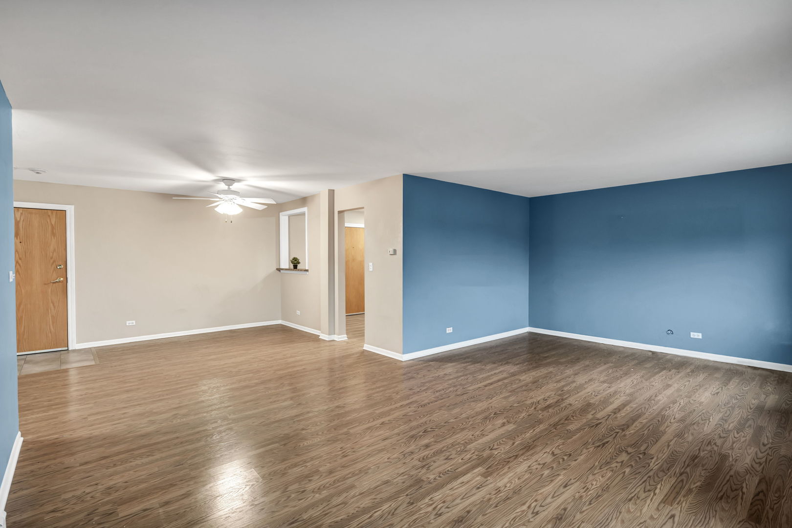 4721 St Joseph Creek Road, Unit 3H Lisle, IL 60532 - Photo 5 of 17 a view of an empty room with wooden floor