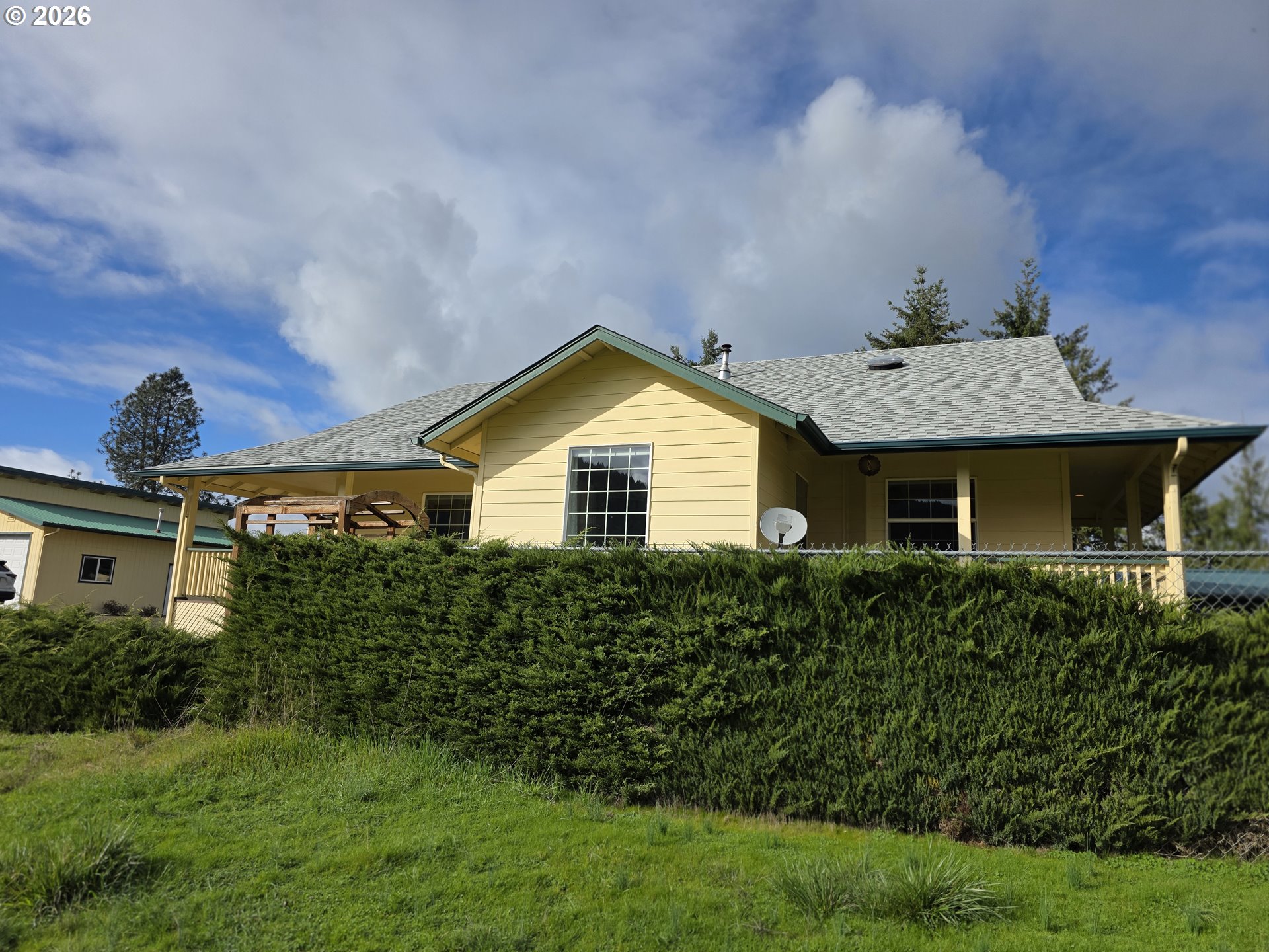 1909 Southwest Duke Road Sutherlin, OR 97479 - Photo 3 of 30 a front view of a house with a yard and garage