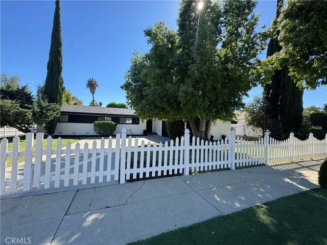 a view of a wrought iron fences in front of house