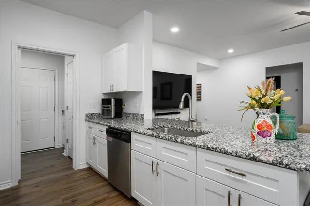 a bathroom with a sink and shower