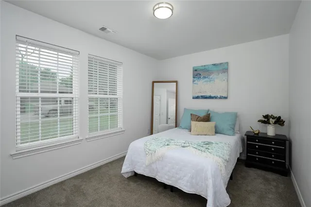 a view of a workspace with furniture and wooden floor
