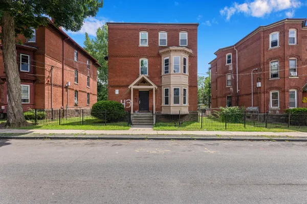 a view of street in front of building