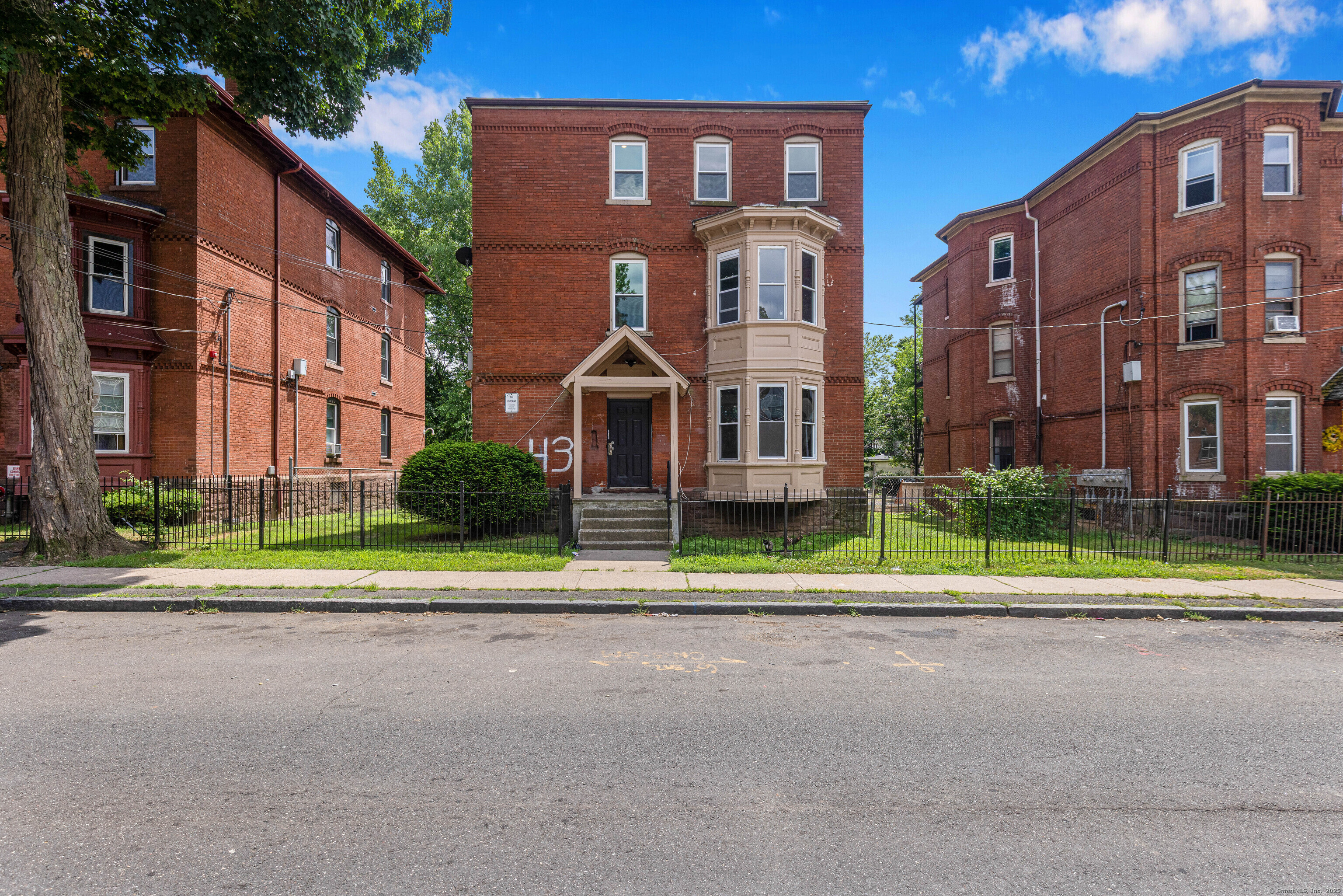 a view of street in front of building