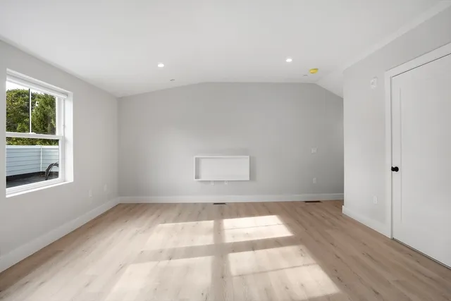 a view of an empty room and a window