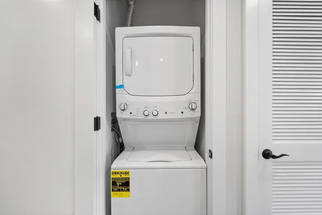 a close view of a utility room with dryer and washer