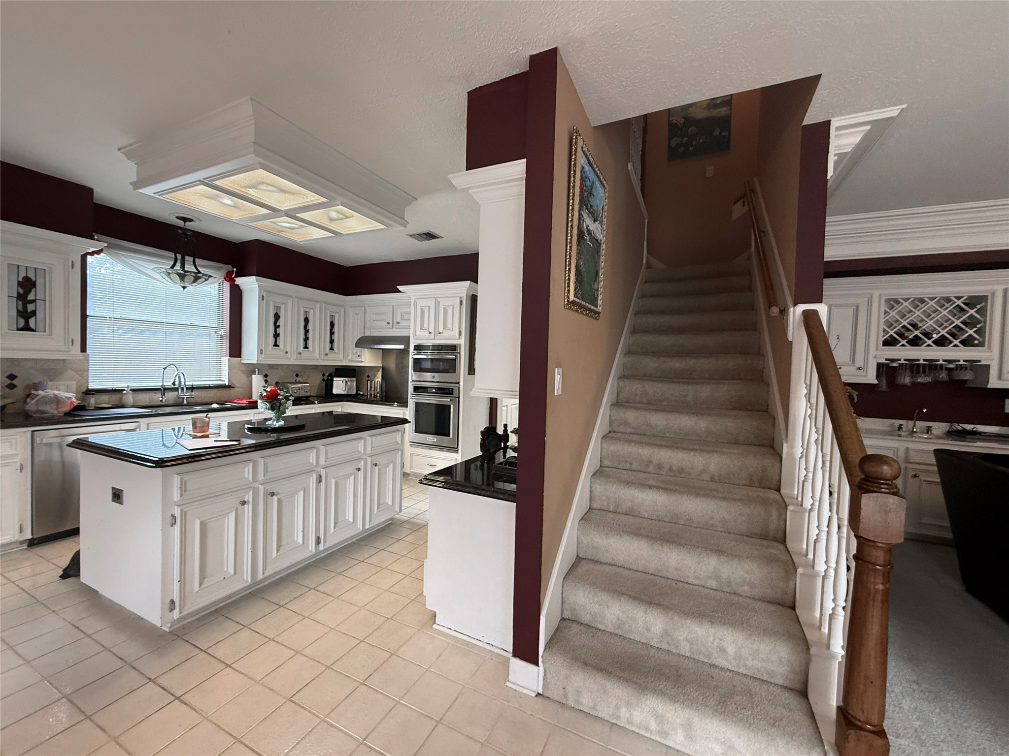 17310 Wyeth Circle Spring, TX 77379 - Photo 15 of 50 Return stairs separates kitchen from den but still allows the space to be open