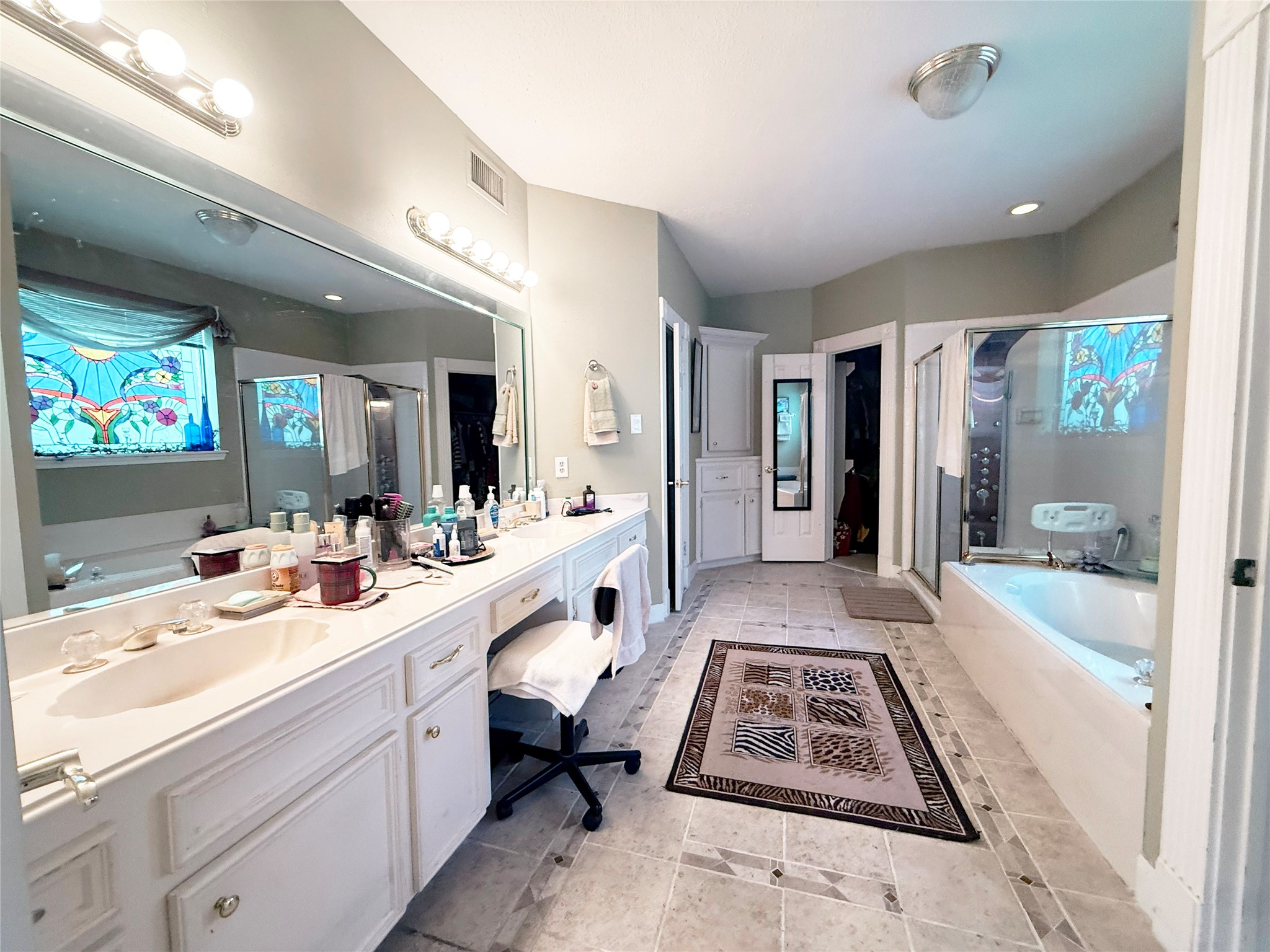 17310 Wyeth Circle Spring, TX 77379 - Photo 30 of 50 Primary bedroom with double closets, double sinks, separate tub & shower plus vanity area