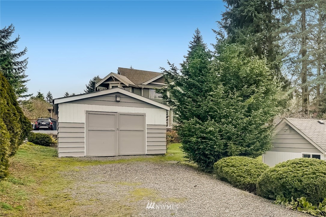 23915 Brier Road Brier, WA 98036 - Photo 2 of 39 a front view of a house with a yard and garage
