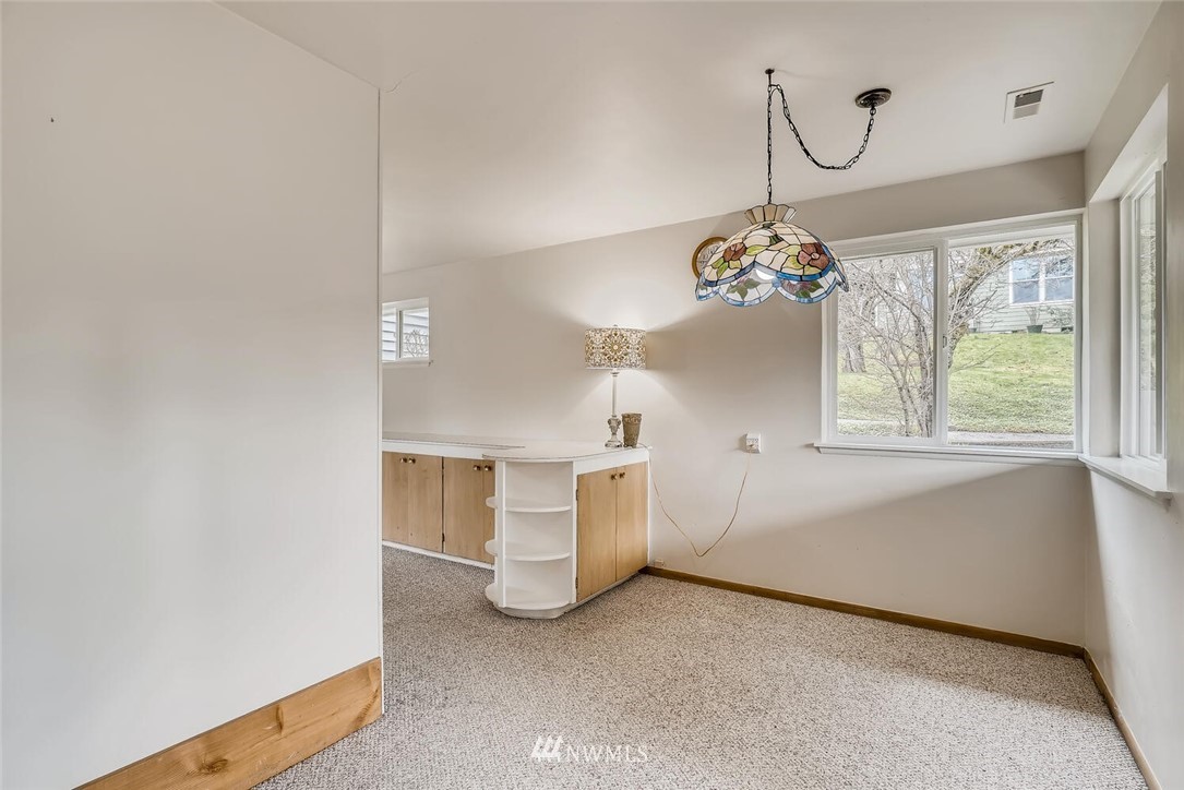 23915 Brier Road Brier, WA 98036 - Photo 20 of 39 a view of a hallway with entryway and chandelier