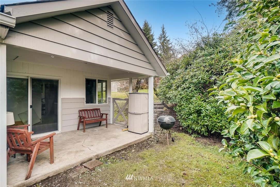 23915 Brier Road Brier, WA 98036 - Photo 31 of 39 a view of a patio with table and chairs and potted plants