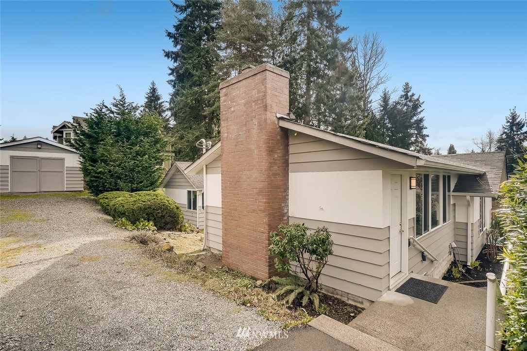 23915 Brier Road Brier, WA 98036 - Photo 36 of 39 a view of a house with a yard and large tree