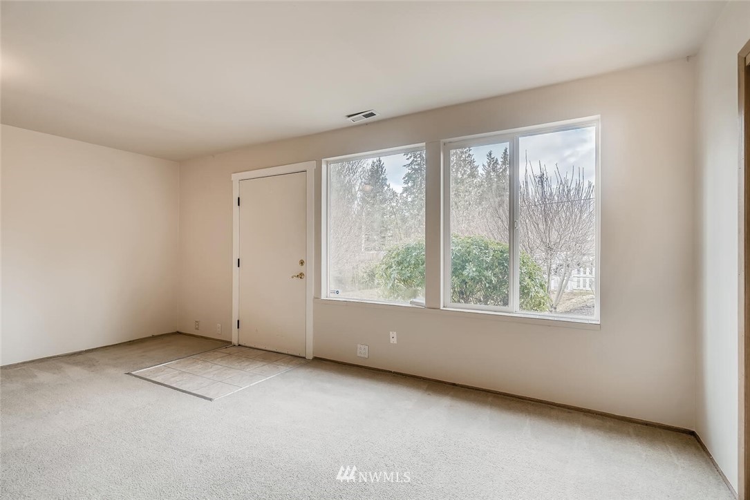 23915 Brier Road Brier, WA 98036 - Photo 9 of 39 an empty room with windows