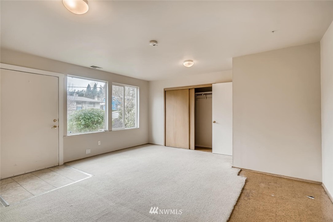 23915 Brier Road Brier, WA 98036 - Photo 10 of 39 a view of a big room with windows and chandelier fan