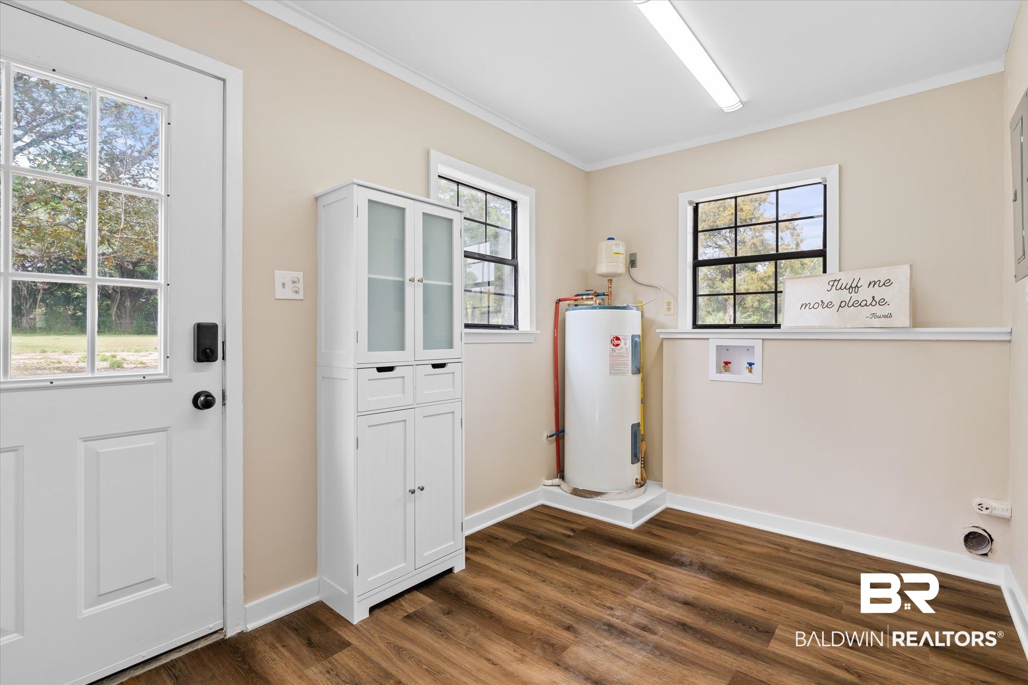4630 General Road Mobile, AL 36619 - Photo 15 of 33 Laundry room with crown molding, electric water heater, dark hardwood / wood-style flooring, and washer hookup