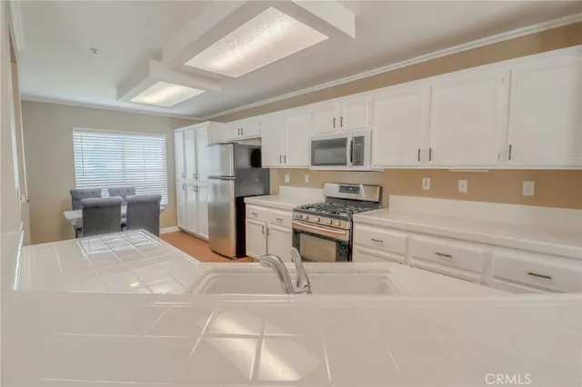 a view of dining room and kitchen with a window