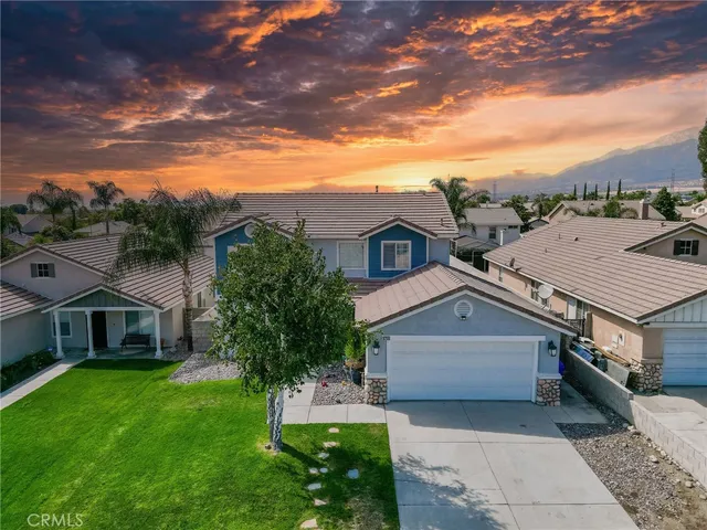 a aerial view of a house with a yard