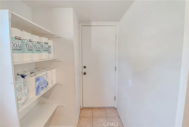 a view of staircase with white walls and a window