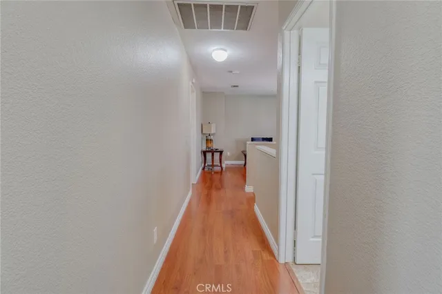 a bedroom with a bed and wooden furniture
