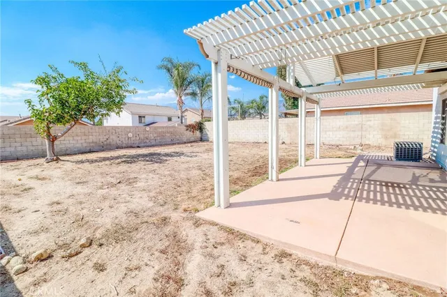 aerial view of a house with a yard