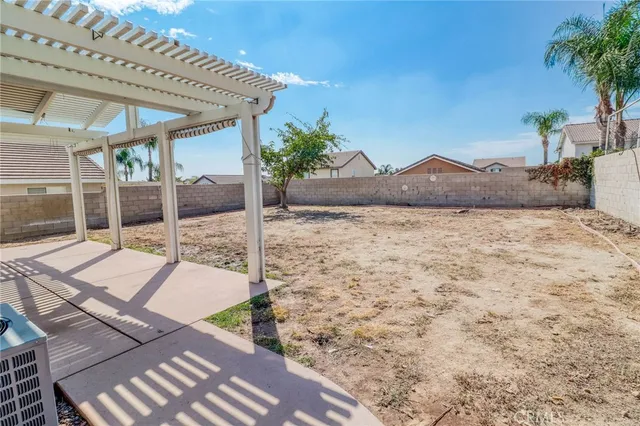 an aerial view of a house with garden space and street view