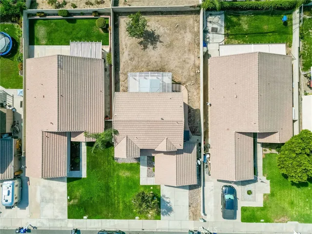 an aerial view of a house with a garden
