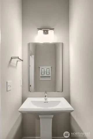 a living room with furniture potted plant and a window