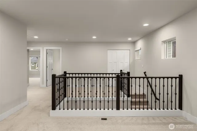 a bedroom with a large bed and a potted plant