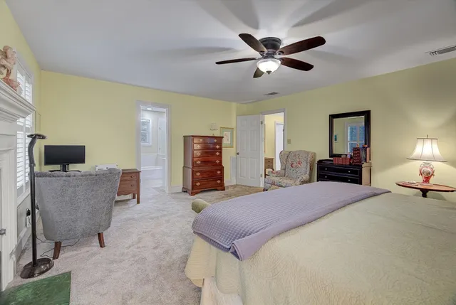 a bed room with a bed and a television