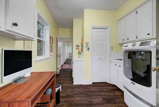 a living room with furniture wooden floor and a fireplace