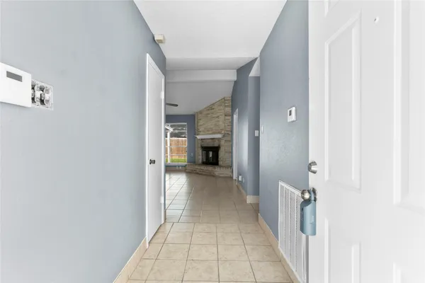 a view of a hallway with a white walls