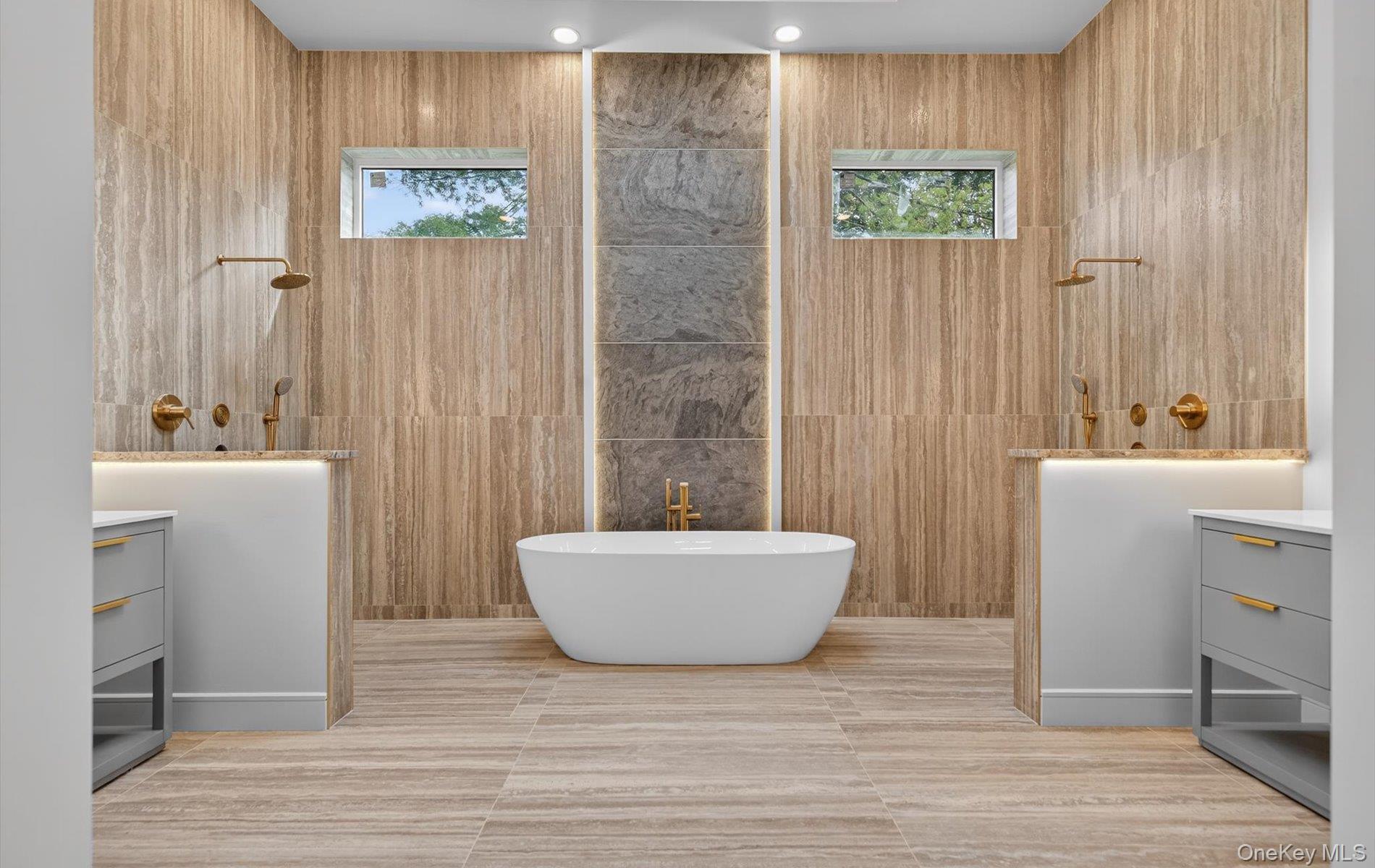 26 Windemere Way Woodbury, NY 11797 - Photo 19 of 40 a bathroom with a sink a bathtub and a toilet