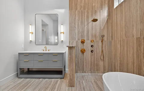 a bathroom with a sink a mirror and a bathtub