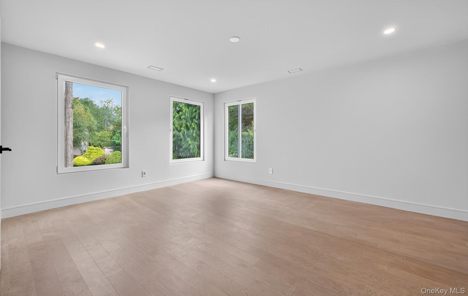 26 Windemere Way Woodbury, NY 11797 - Photo 26 of 40 an empty room with windows