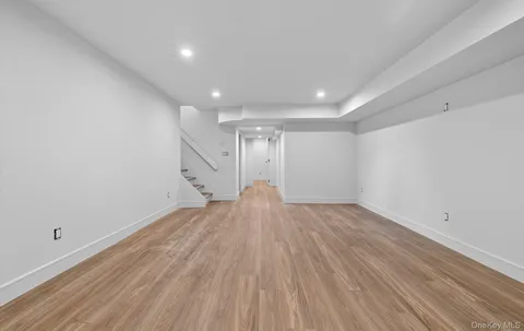 a view of a house with a large windows and plants