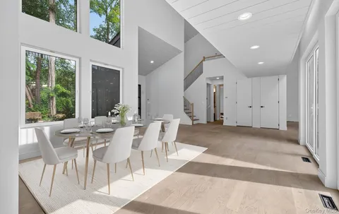 a view of a dining room with furniture window and outside view