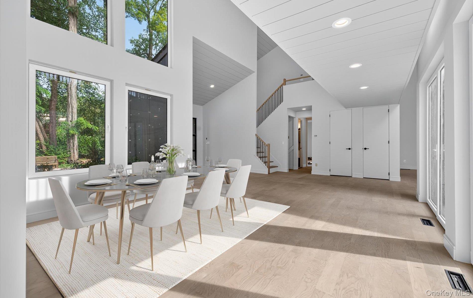 26 Windemere Way Woodbury, NY 11797 - Photo 6 of 40 a view of a dining room with furniture window and outside view