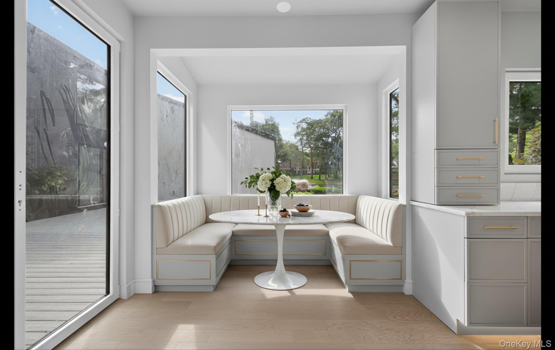 26 Windemere Way Woodbury, NY 11797 - Photo 9 of 40 a living room with furniture and a large window