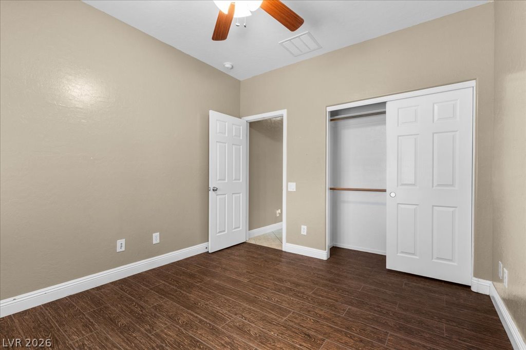 2627 Dirleton Place Henderson, NV 89044 - Photo 25 of 42 Hardwood look tile flooring and a ceiling fan create a comfortable atmosphere.