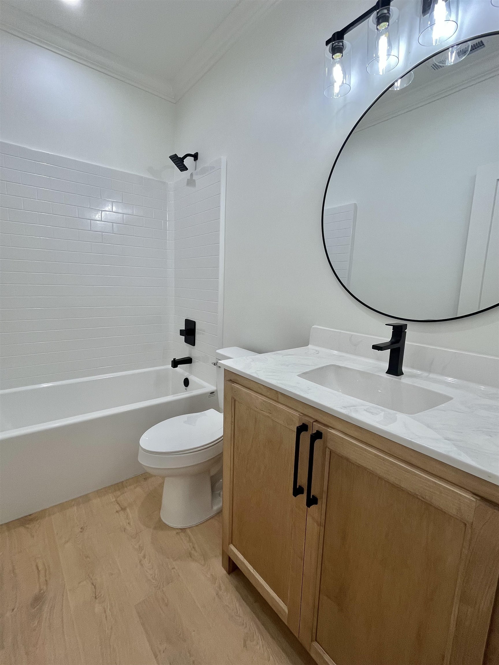 135 Paine Road Savannah, TN 38372 - Photo 11 of 14 a bathroom with a toilet a sink and mirror