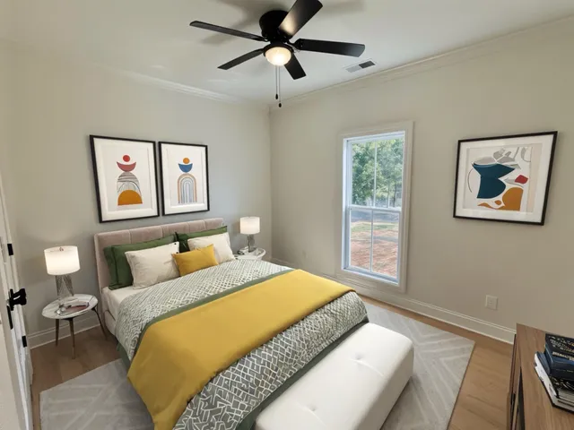 a bedroom with a large bed and a chandelier