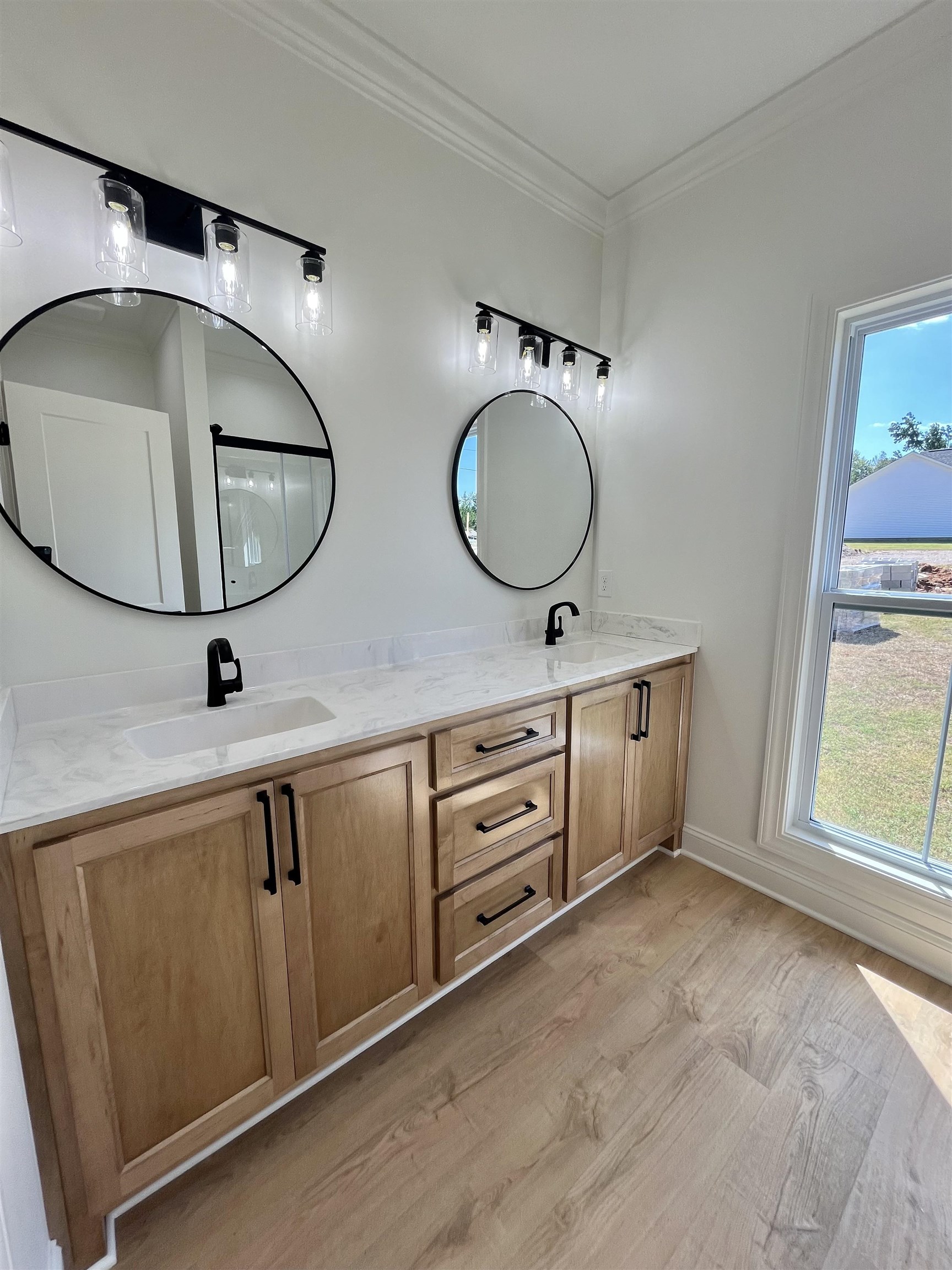 135 Paine Road Savannah, TN 38372 - Photo 10 of 14 a bathroom with a double vanity sink and a mirror
