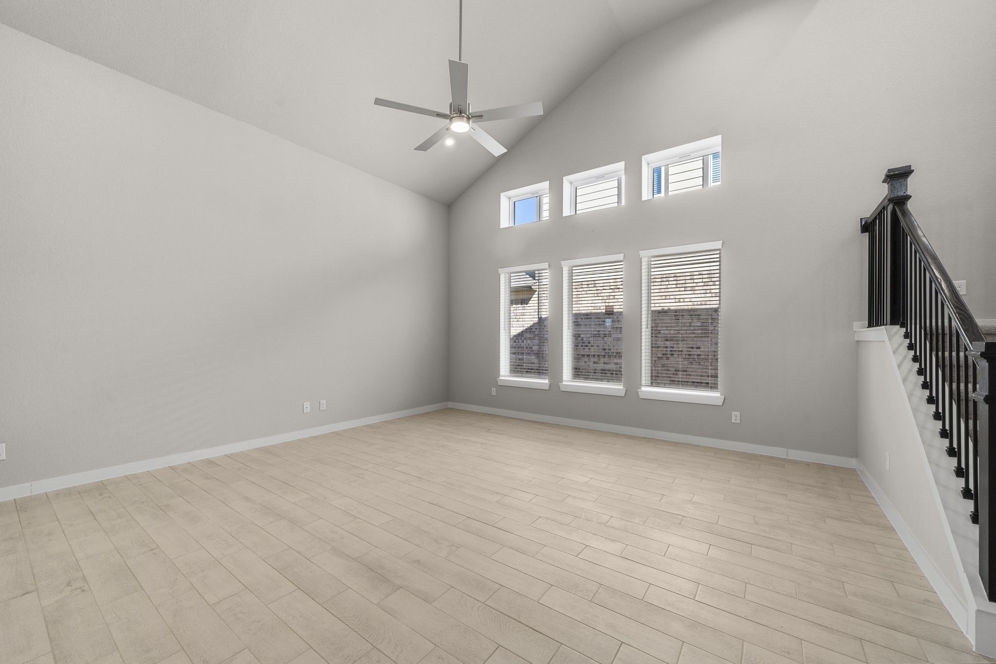 2567 Forest Cedar Lane Conroe, TX 77301 - Photo 12 of 40 a view of an empty room with a window and wooden floor