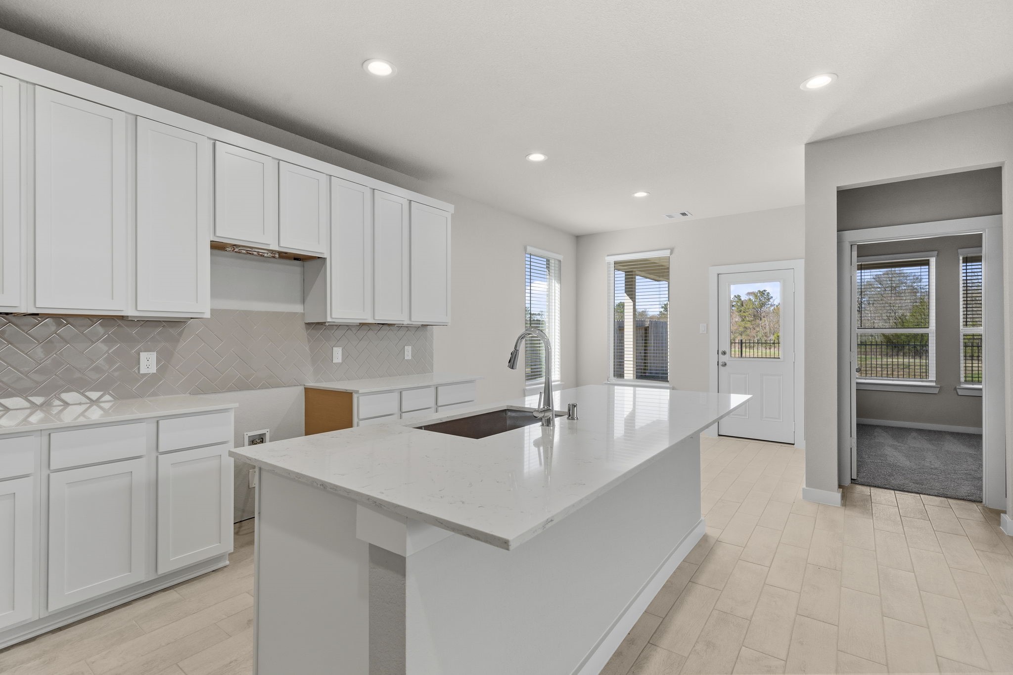 2567 Forest Cedar Lane Conroe, TX 77301 - Photo 5 of 40 a kitchen with sink cabinets and counter space