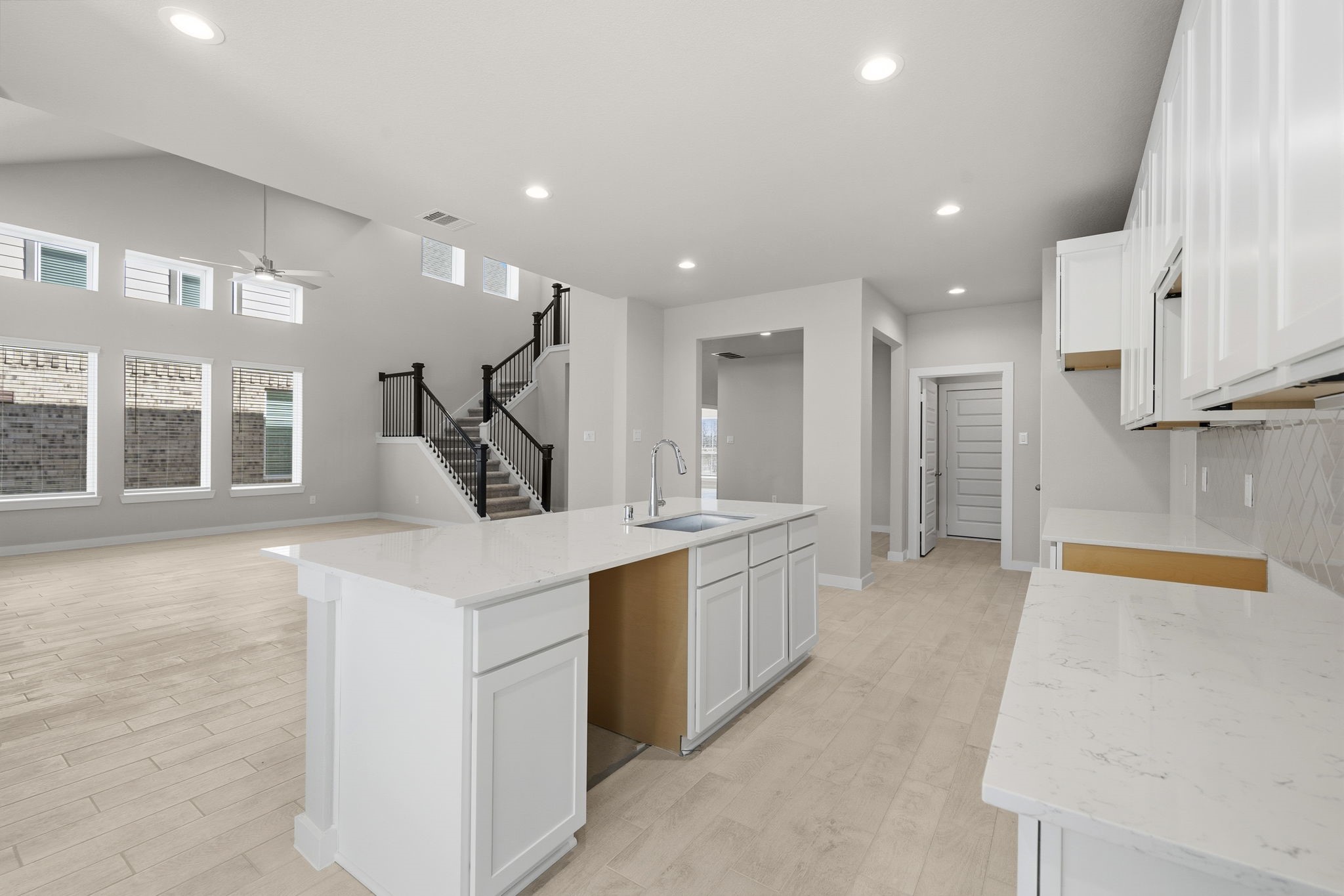 2567 Forest Cedar Lane Conroe, TX 77301 - Photo 6 of 40 a kitchen with stainless steel appliances granite countertop a sink and a refrigerator