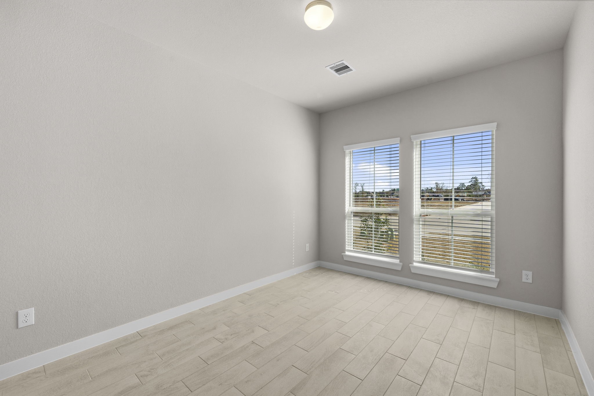 2567 Forest Cedar Lane Conroe, TX 77301 - Photo 7 of 40 an empty room with windows