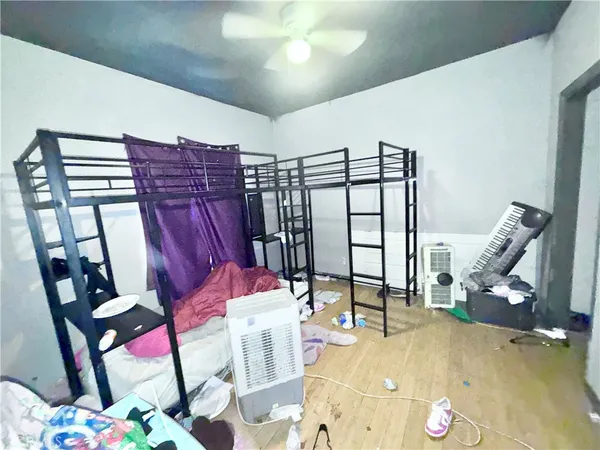 a view of a livingroom with furniture and a floor to ceiling window