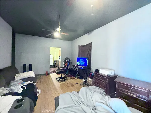 a bed room with a bed mirror and a window