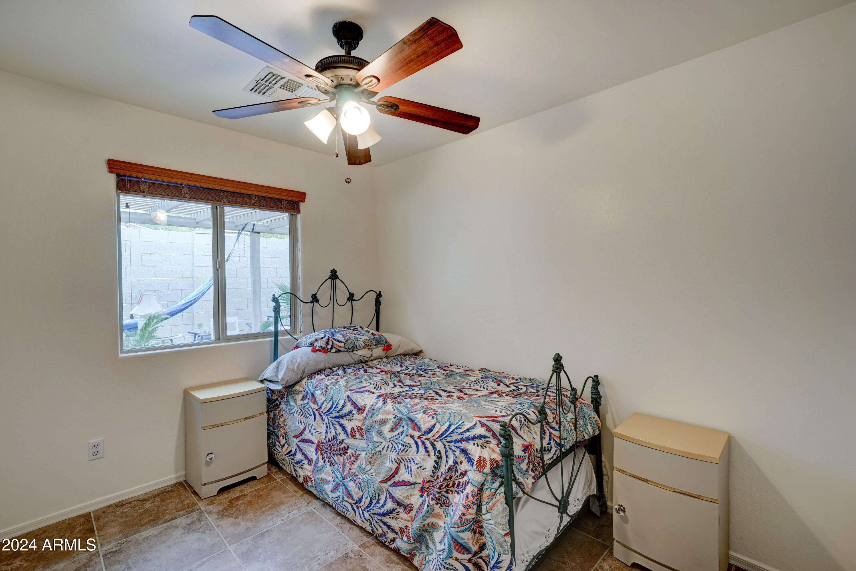 2101 South Meridian Road, Unit 157 Apache Junction, AZ 85120 - Photo 11 of 51 a bedroom with a bed and a window